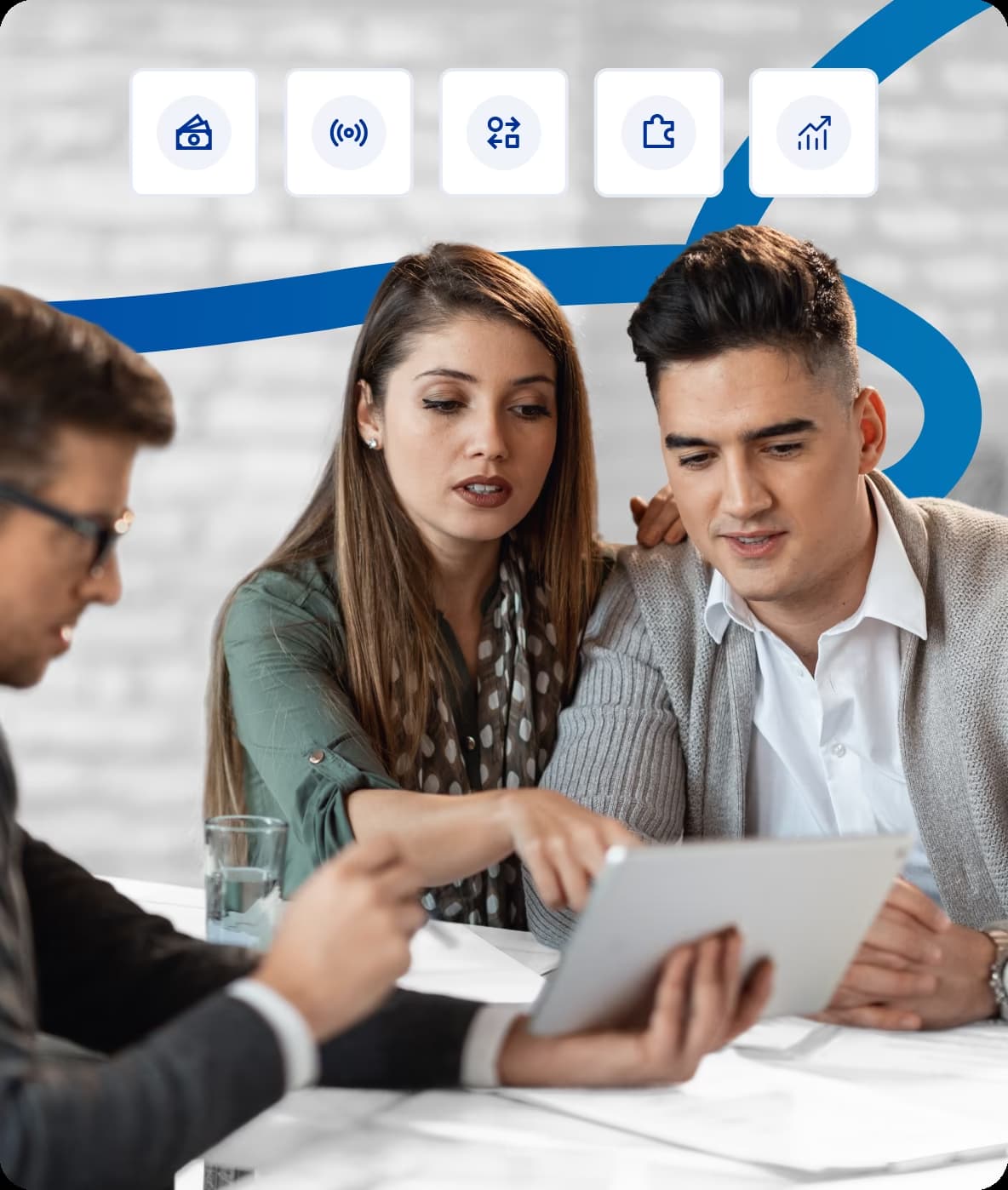 team discussing data on a tablet during a business meeting