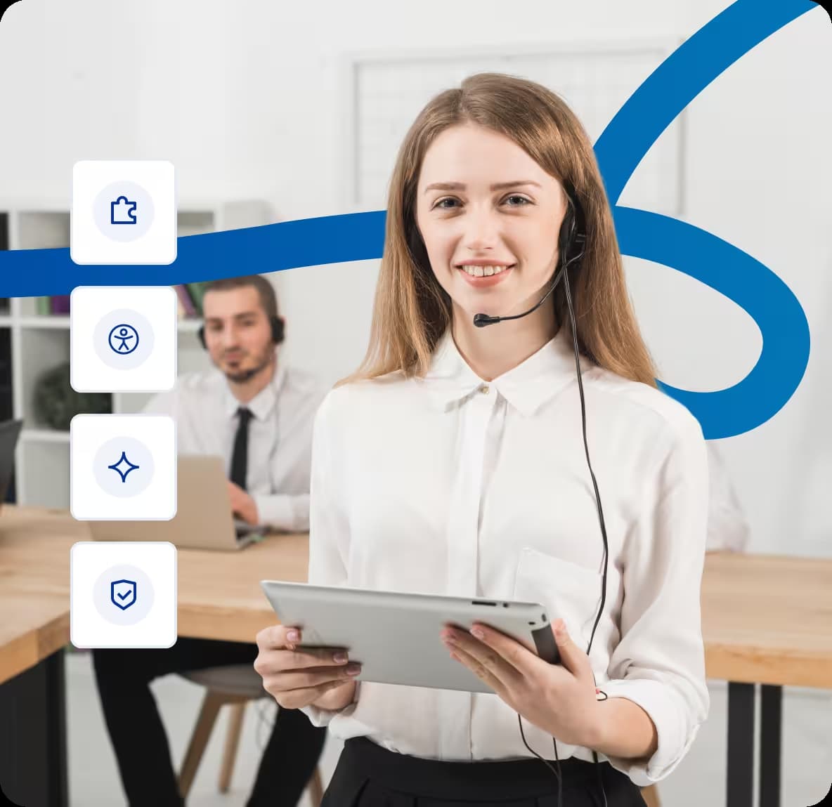 Customer support agent wearing headset holding tablet in office