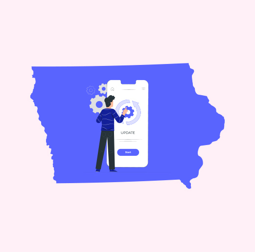 A person pointing at smartphone displaying update with Iowa state map in background