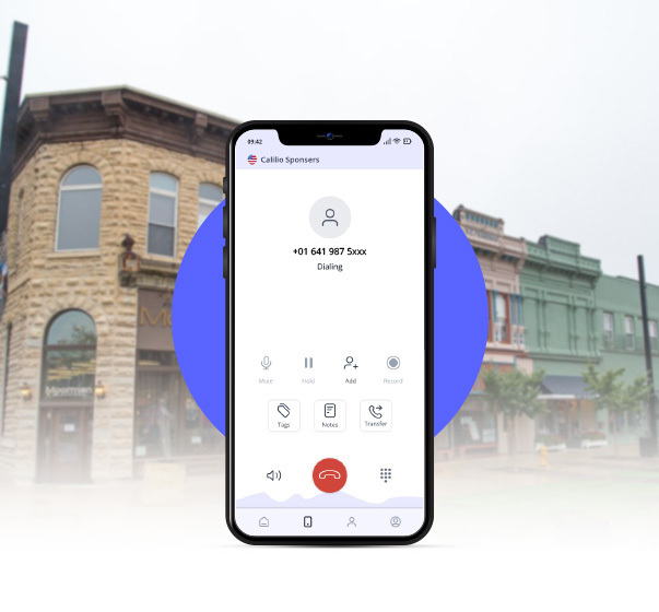 Downtown Mason City in background with  a smartphone dialing 641 area code number